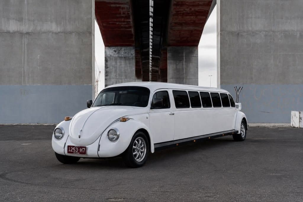 White VW Beetle stretch limousine under the Bolte Bridge, Melbourne