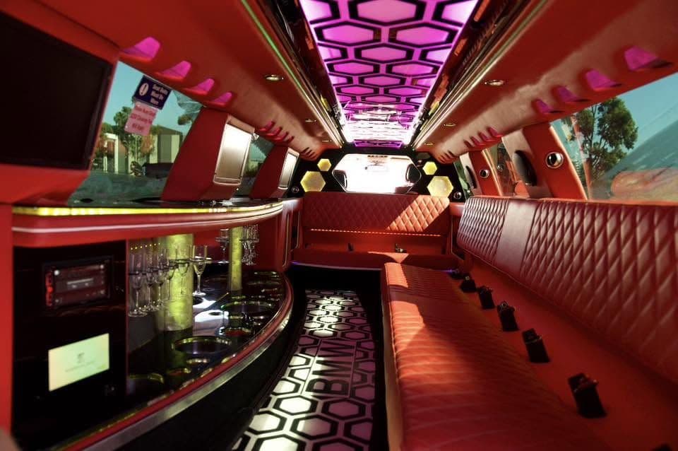 Inside the BMW X5M limousine — red leather, bar and LED ceiling, Melbourne limo hire