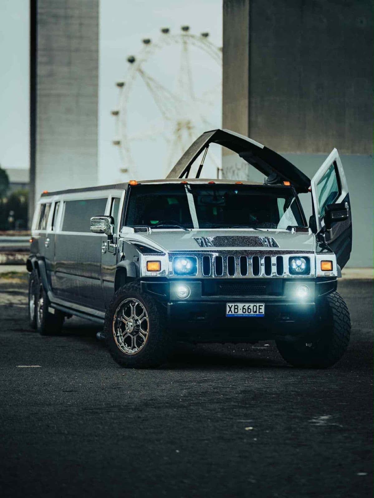 Black Hummer 6x6 with its doors open, Melbourne