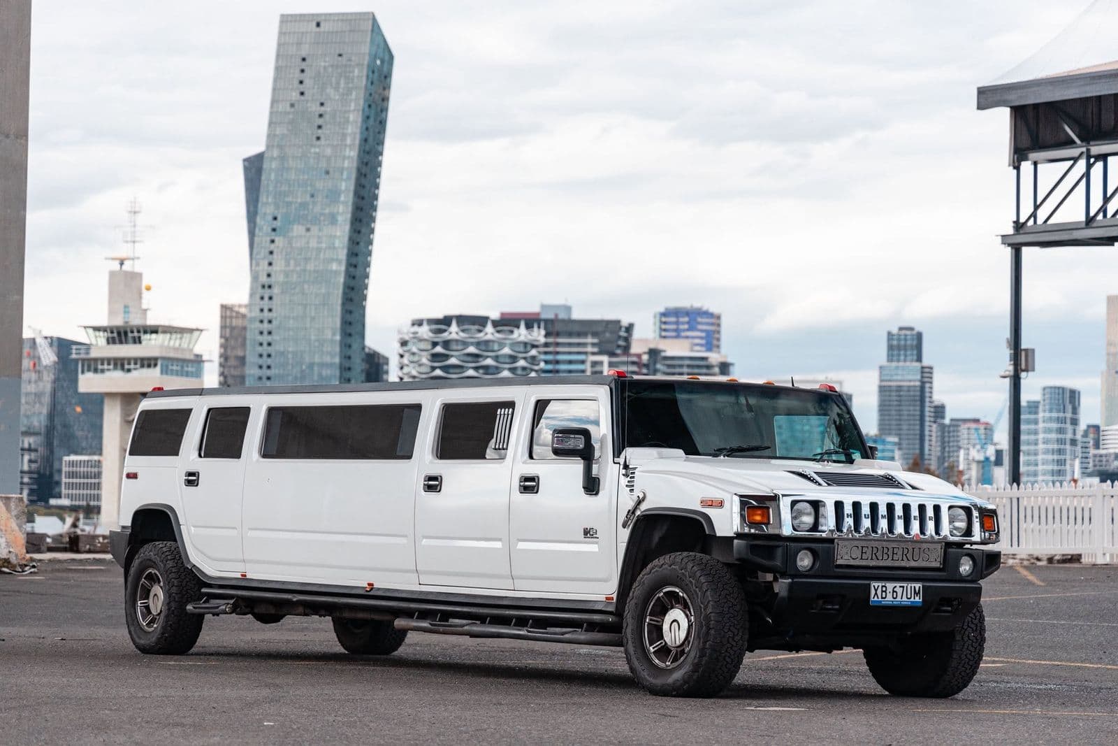 White Hummer limousine with the Docklands skyline, Melbourne